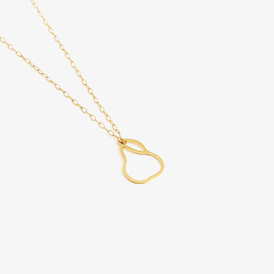 A minimalist pear charm on a gold-filled necklace by Talia Sari, because you know all good things come in pears...